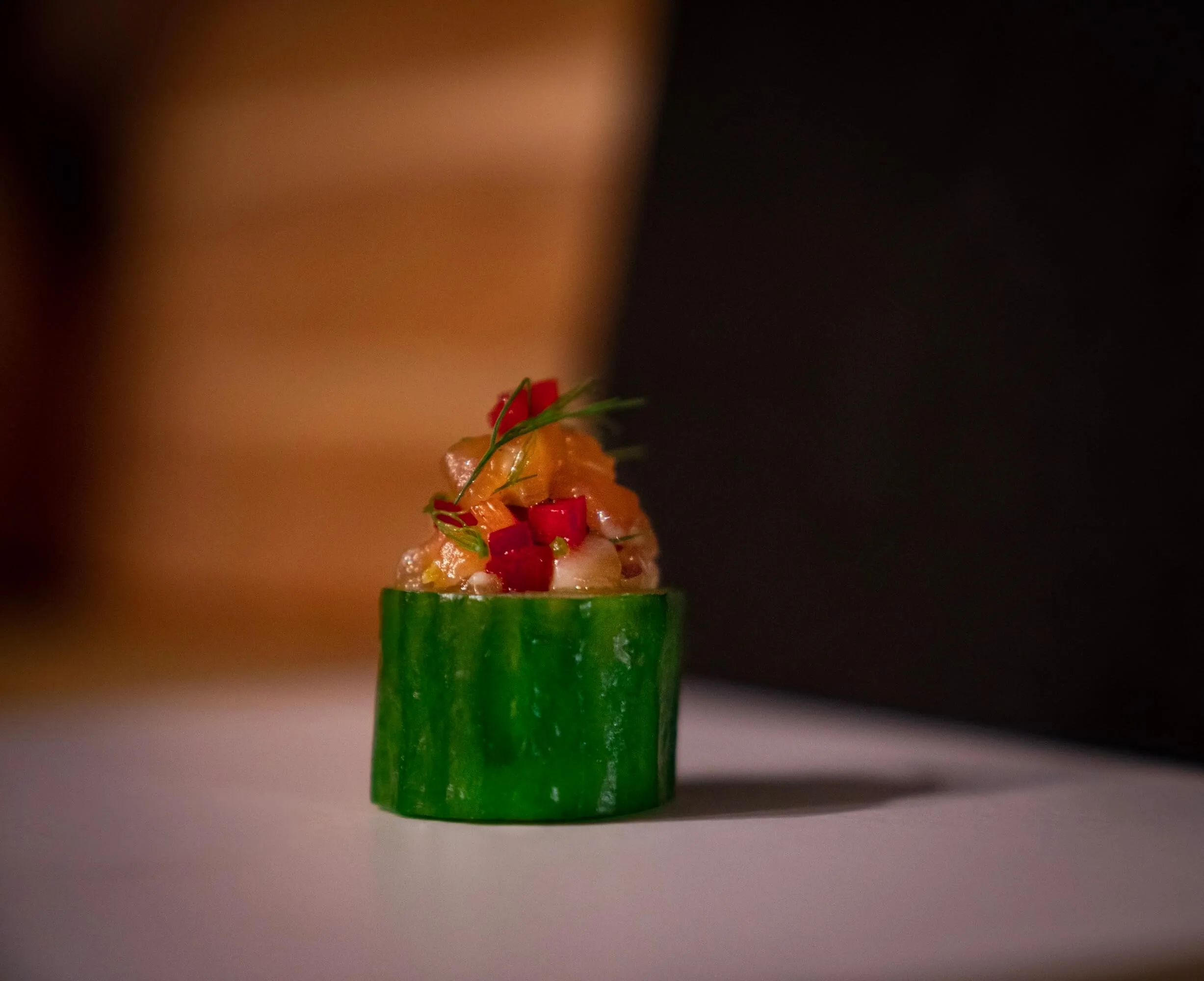 Tuna tartare served in a hollowed cucumber cup