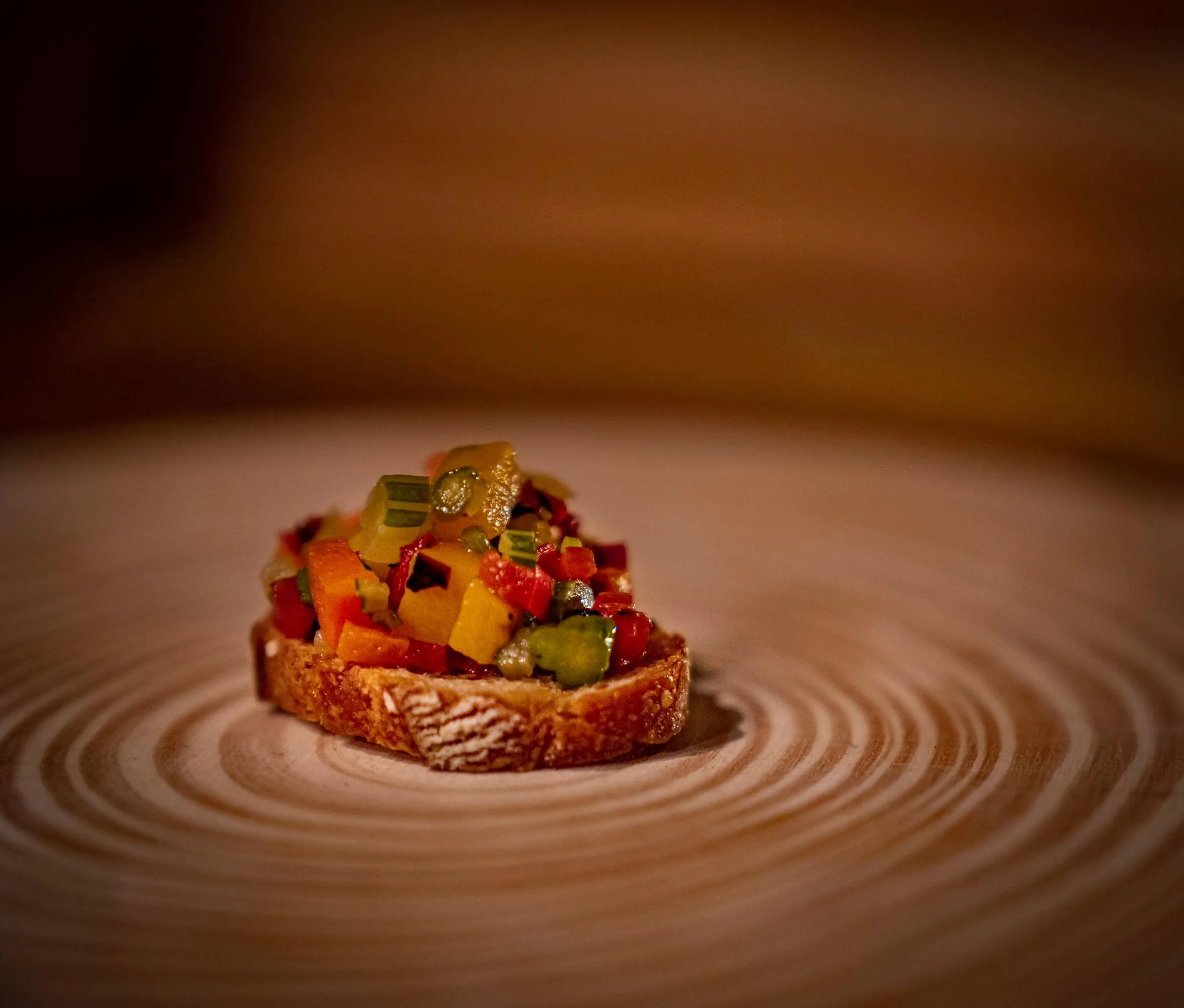 Crostini topped with diced pepper and vegetable relish