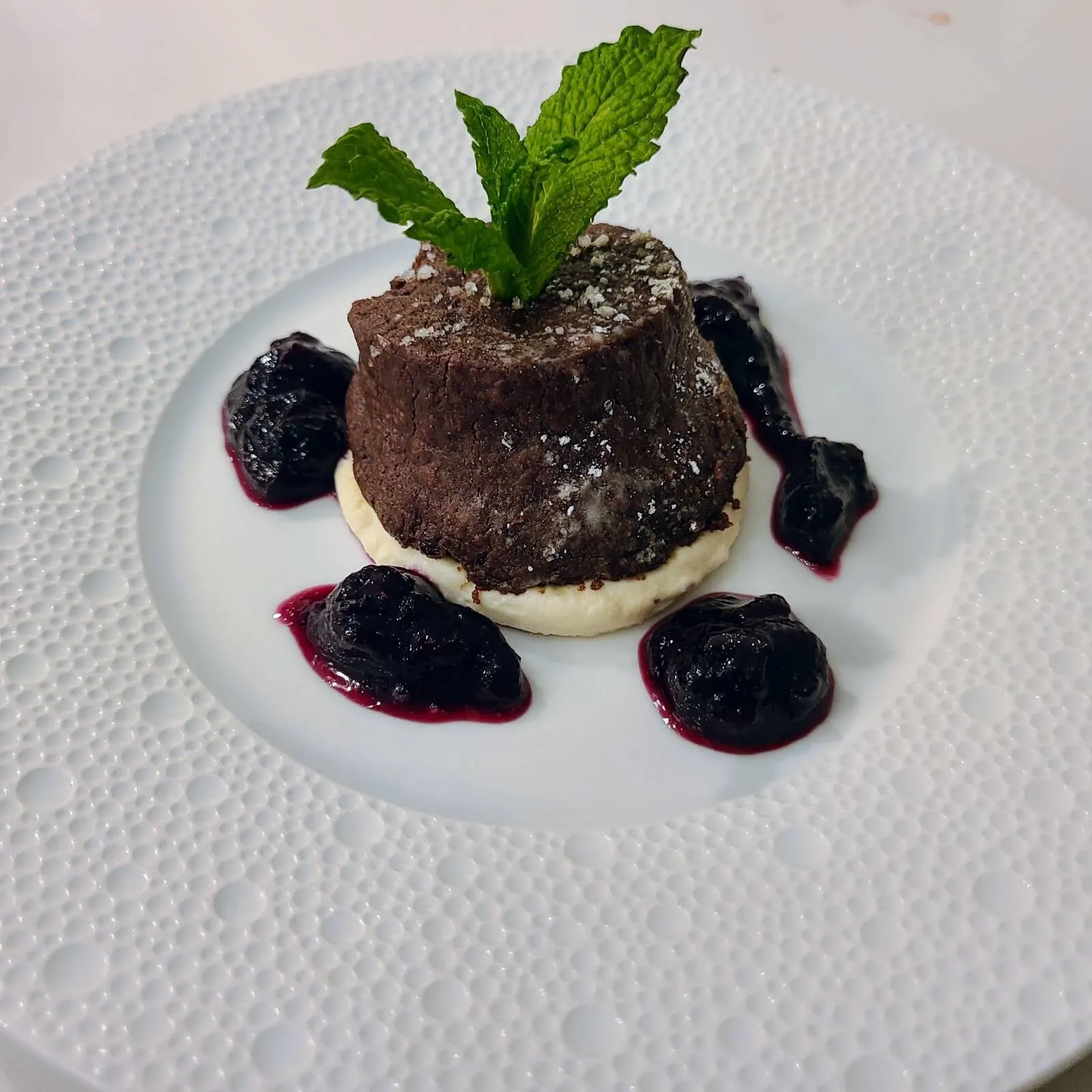 Chocolate torte with blueberry compote and mint
