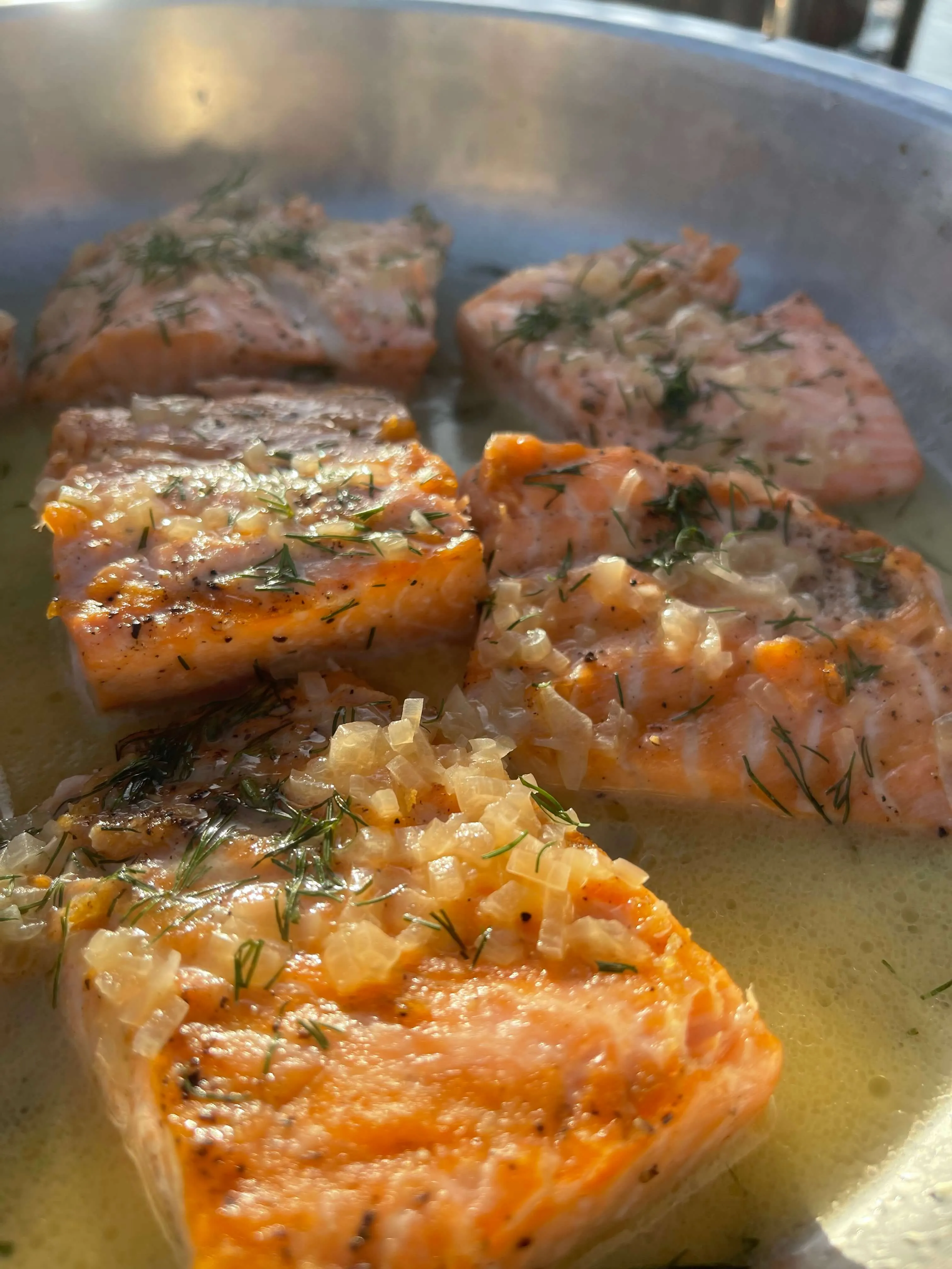 Pan-seared salmon fillets with dill and shallots in butter sauce