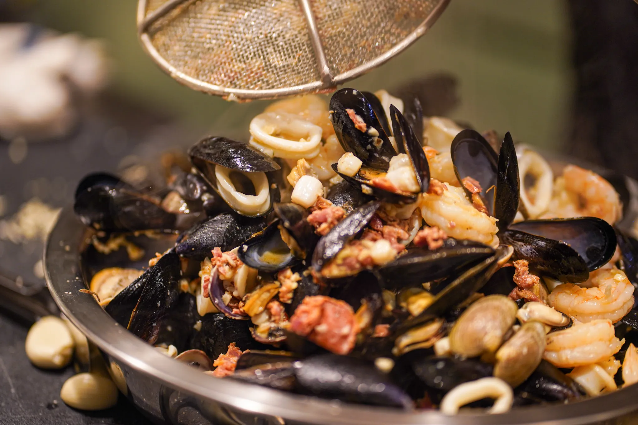 Seafood pan with mussels, clams, shrimp, calamari, and chorizo