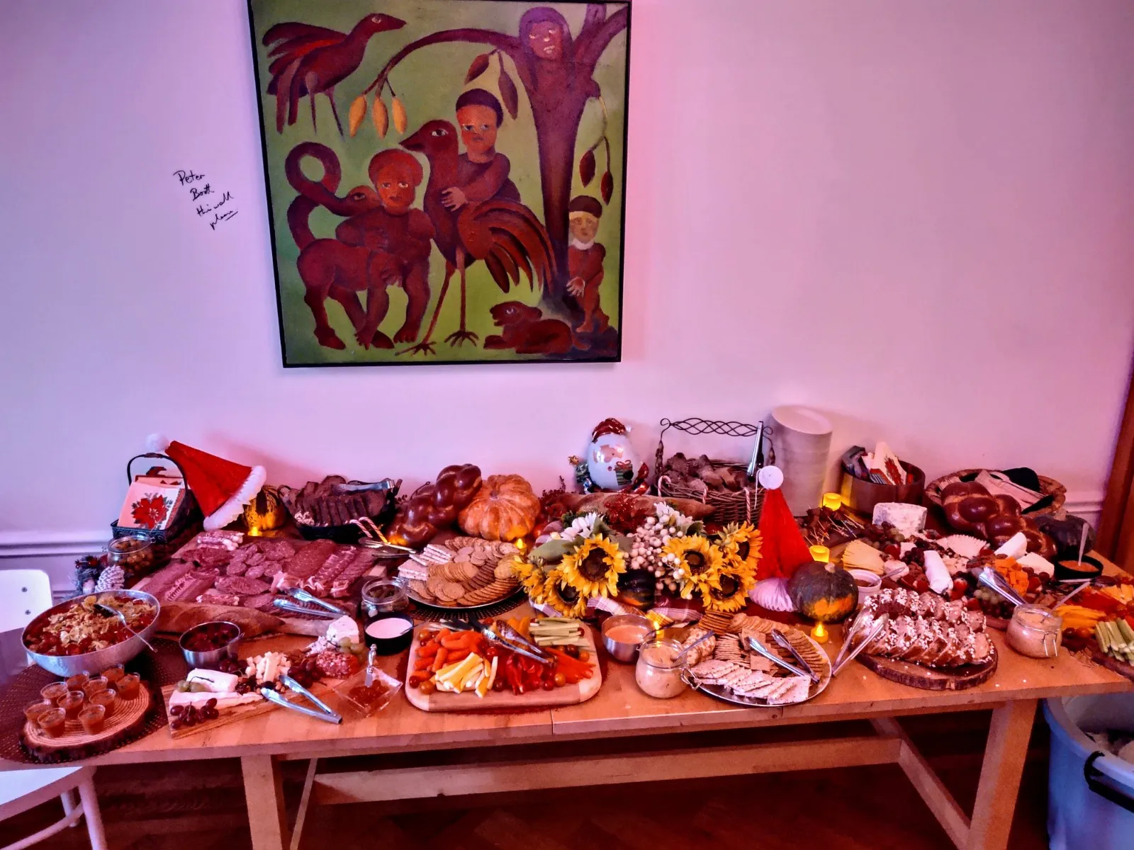 Large holiday grazing table of charcuterie, cheeses, and crackers
